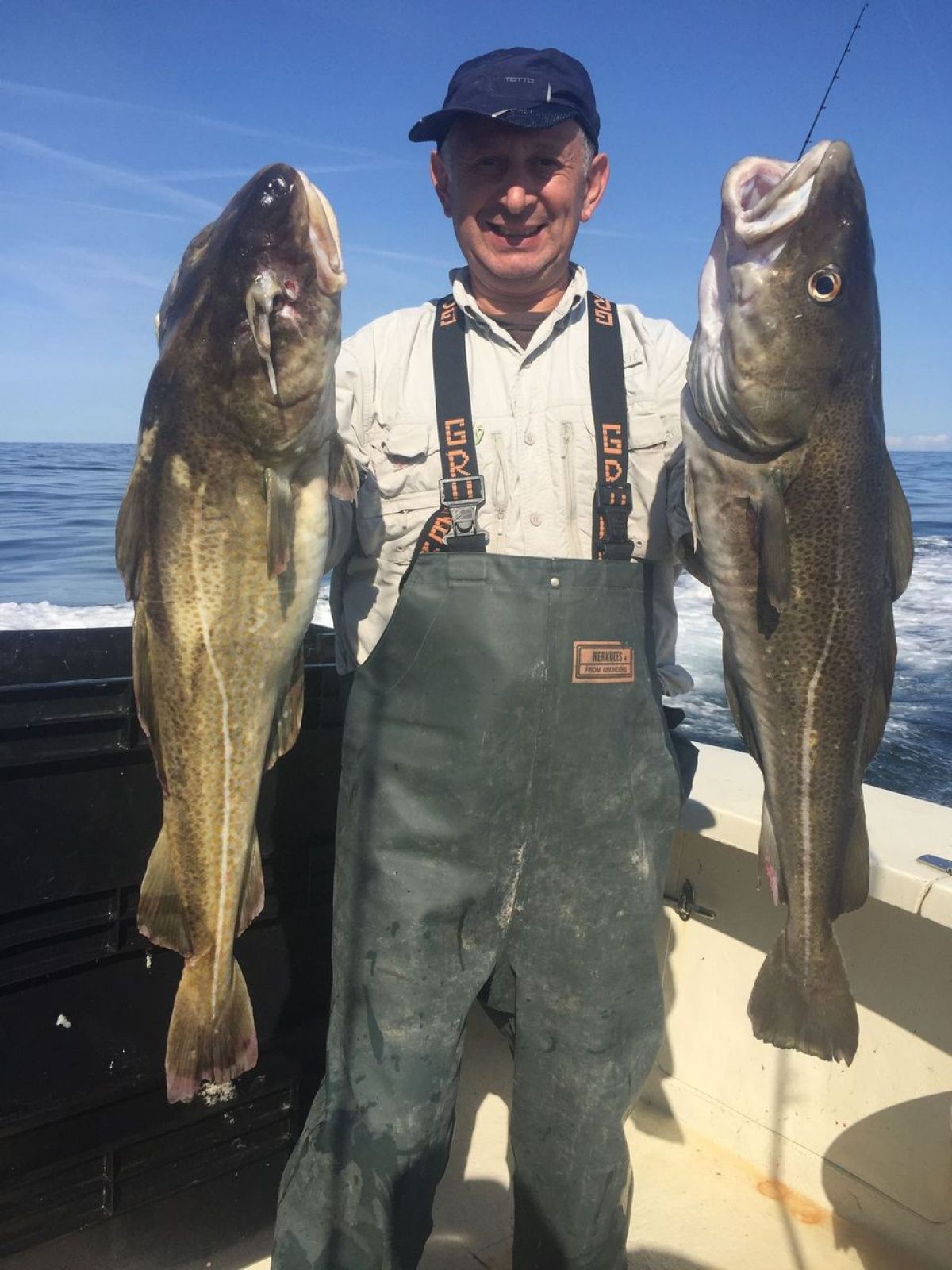 a man holding a fish