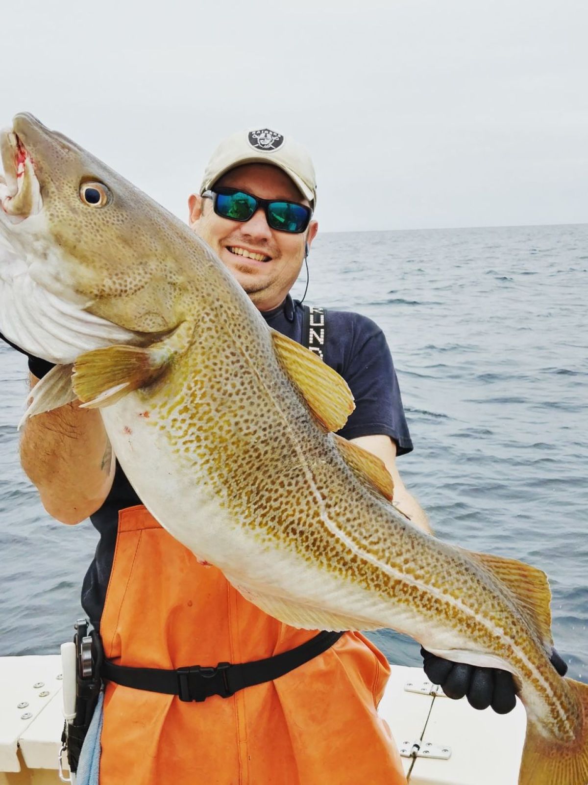 a person holding a fish in the water