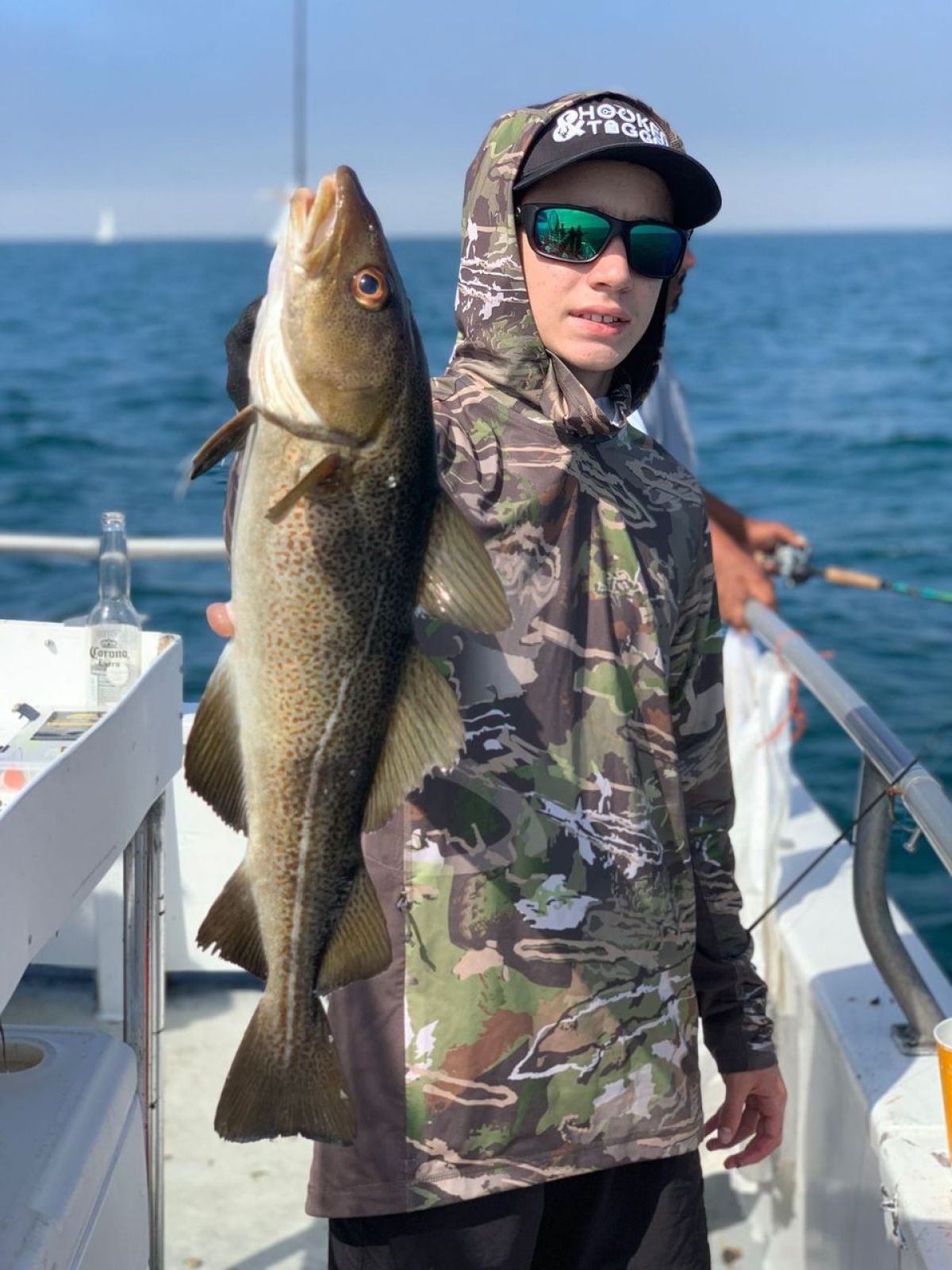 a man holding a fish in the water