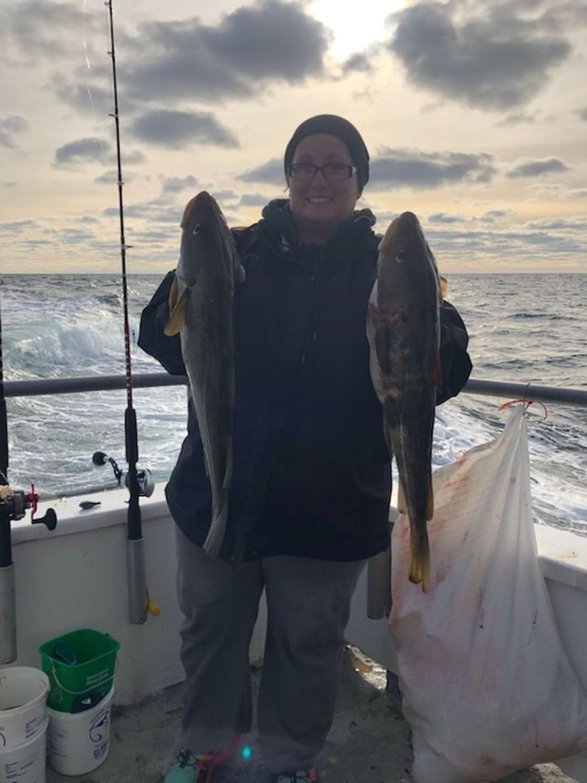 a person holding a fish in the water