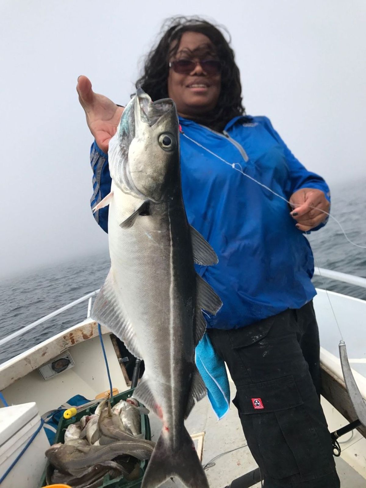 a person holding a fish