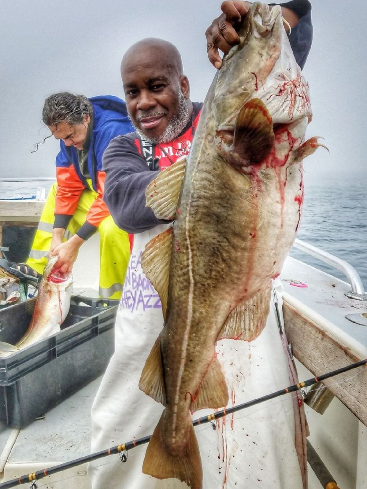 a man holding a fish
