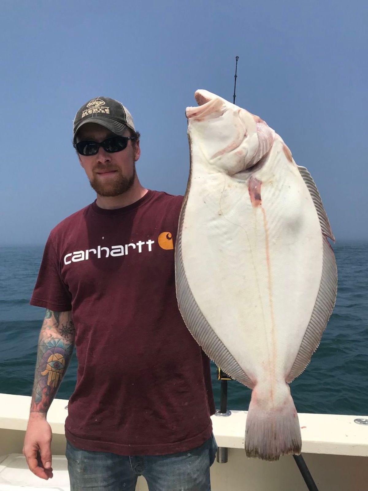 a man holding a fish