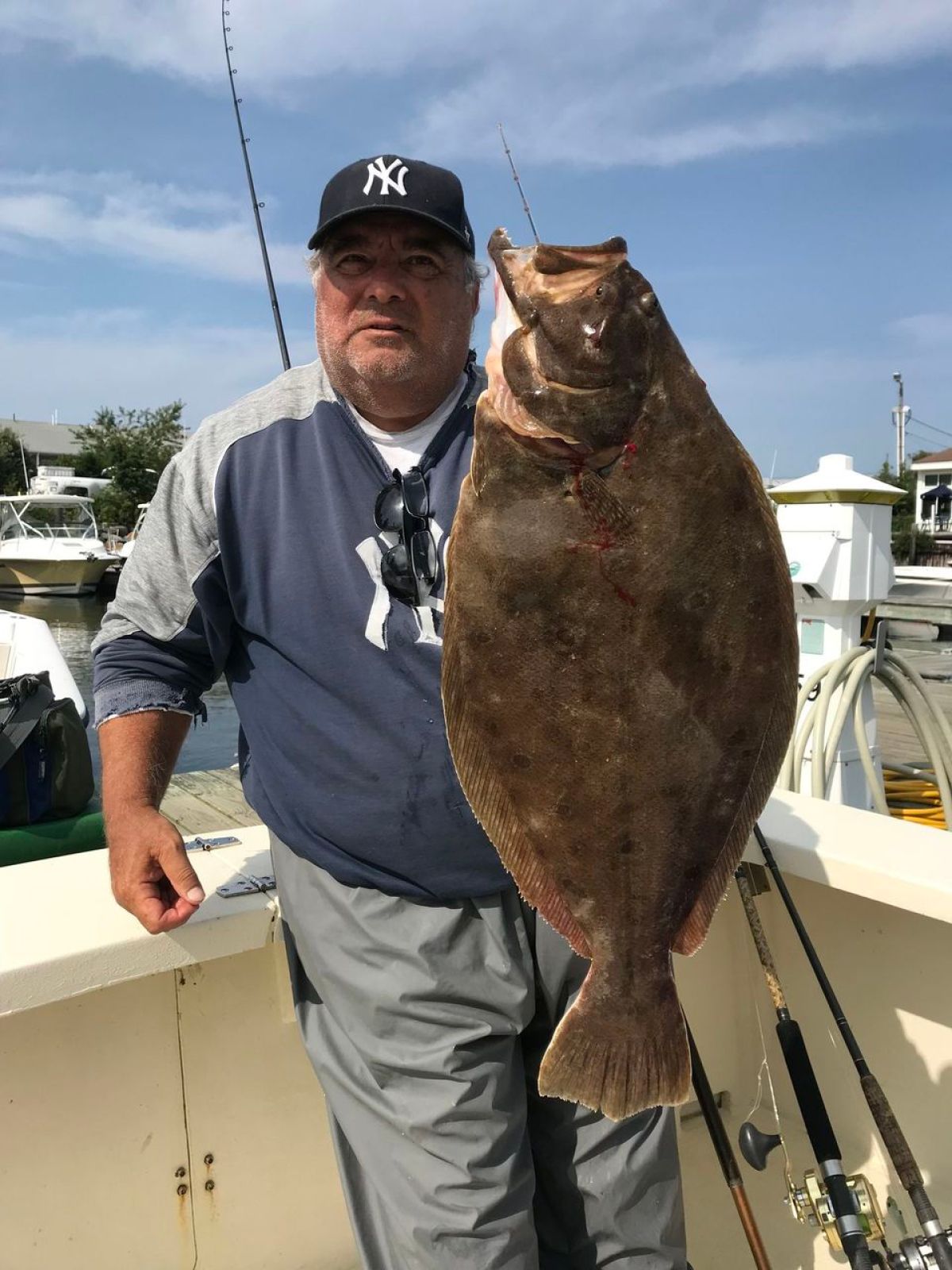 a man holding a fish