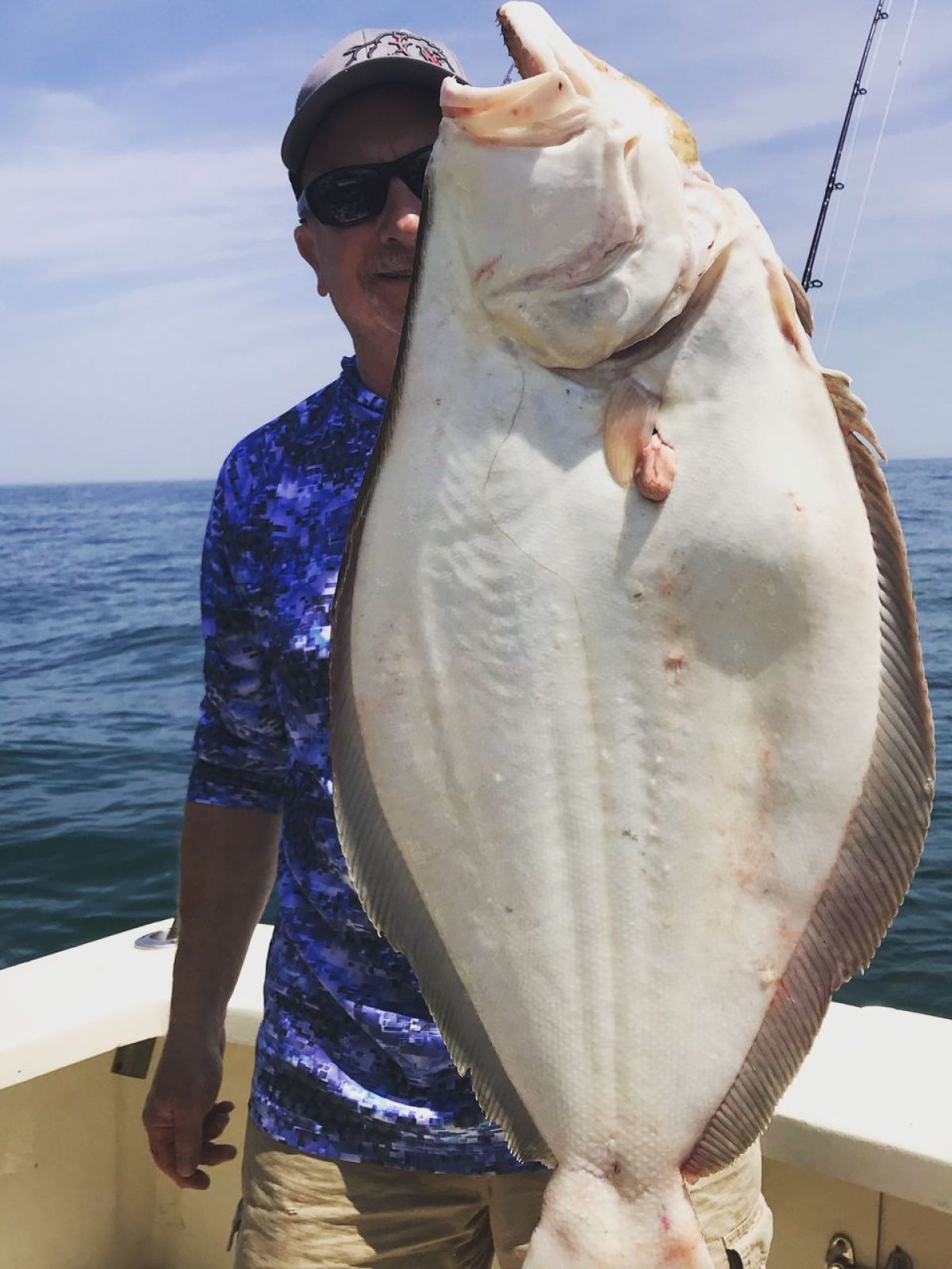 a person holding a fish in the water