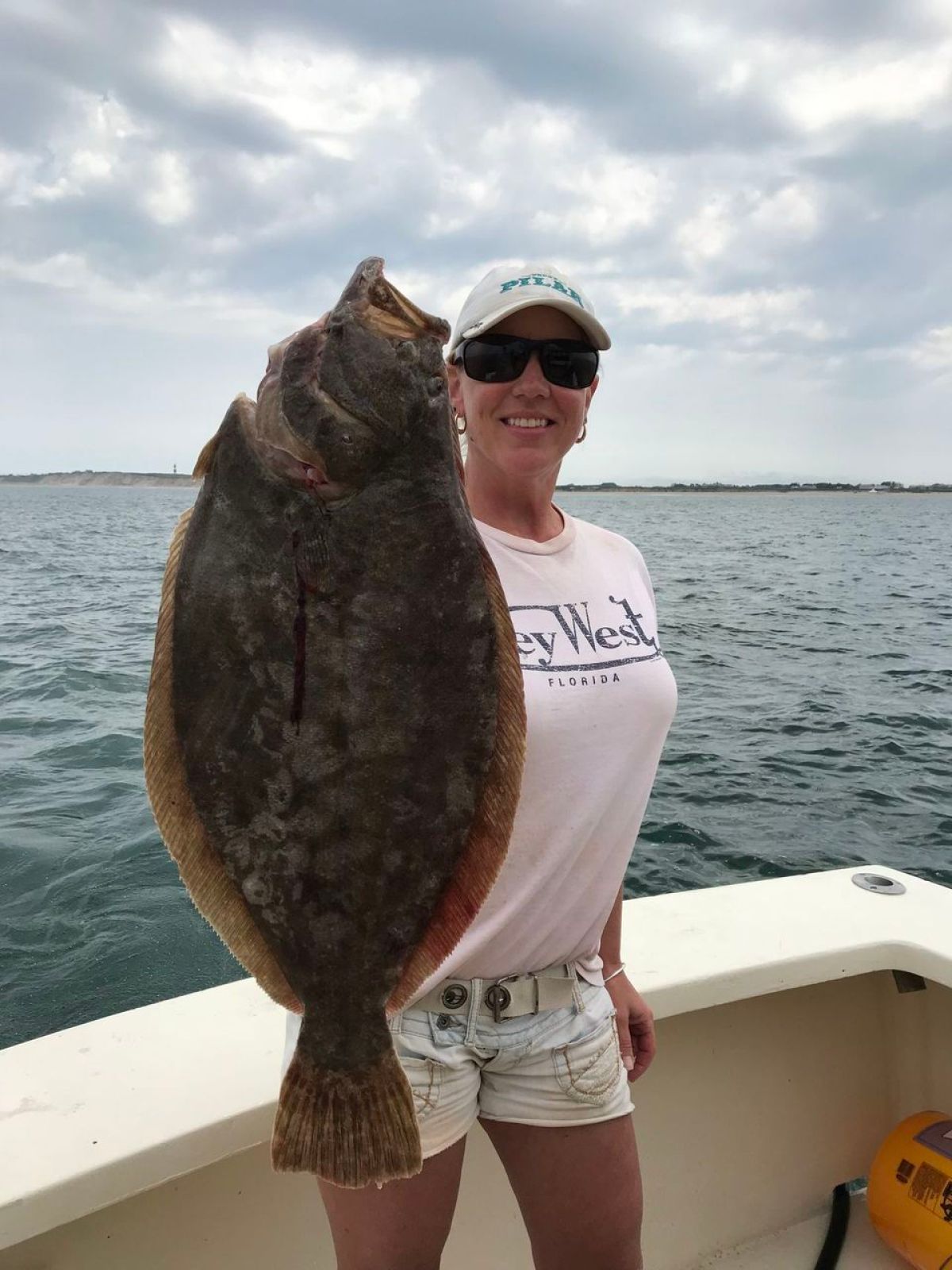 a person holding a fish in the water