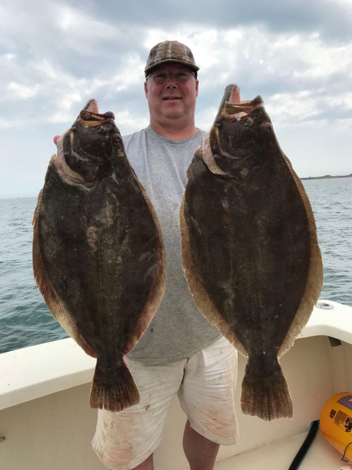 a person holding a fish