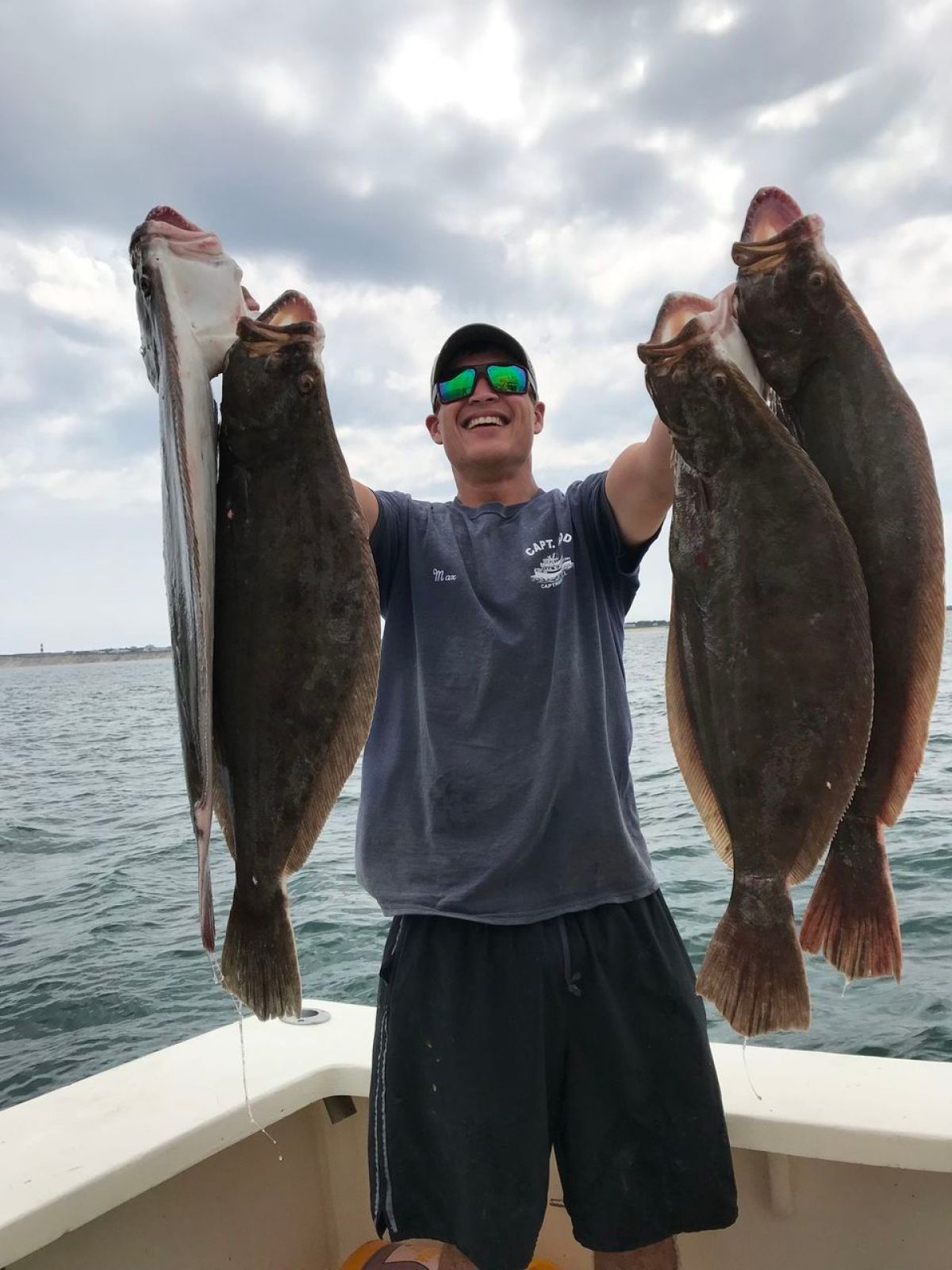a person holding a fish in the water