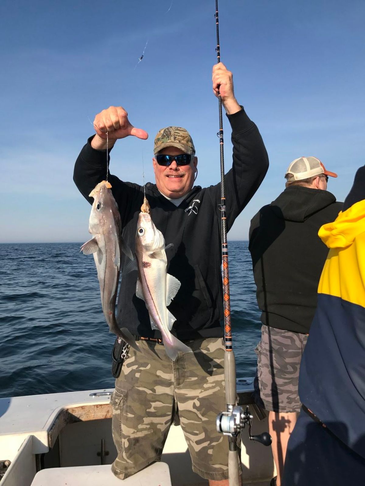 a couple of people that are standing in the water