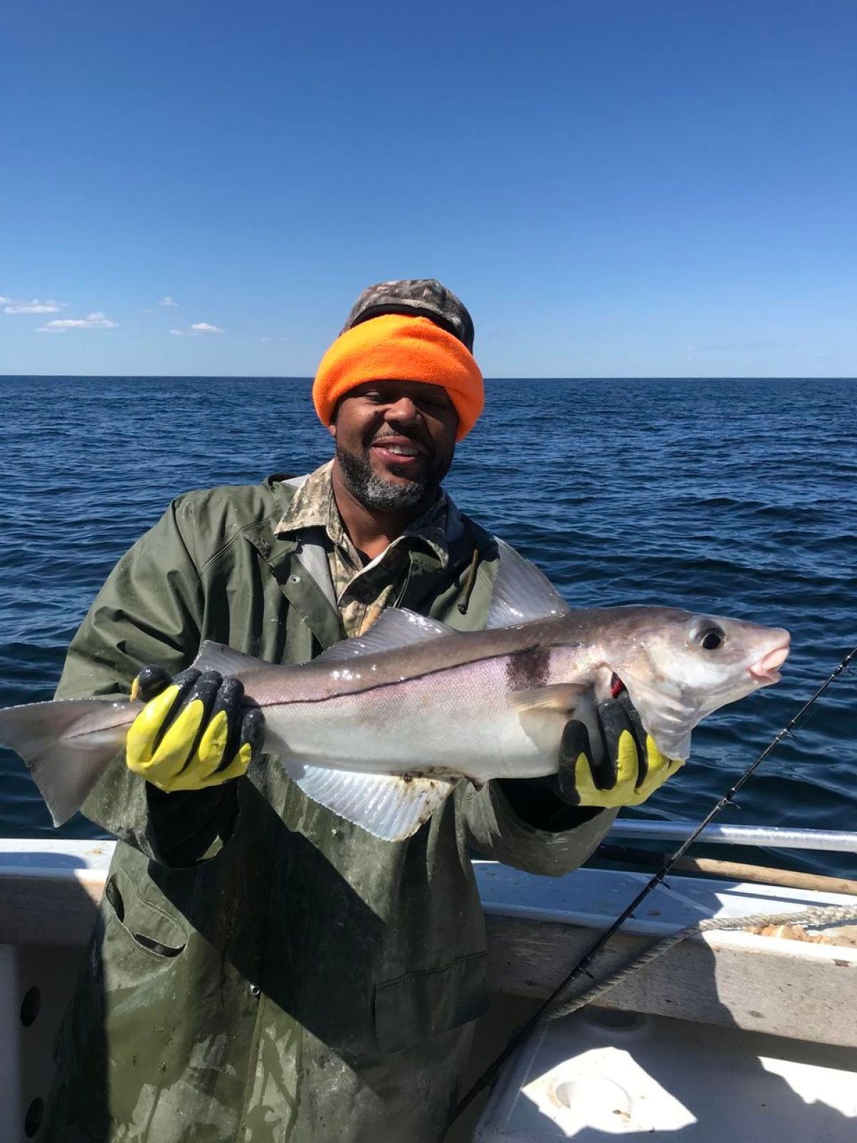 a man holding a fish in the water