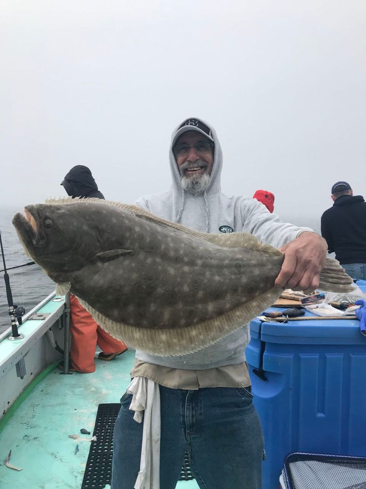 a man holding a fish