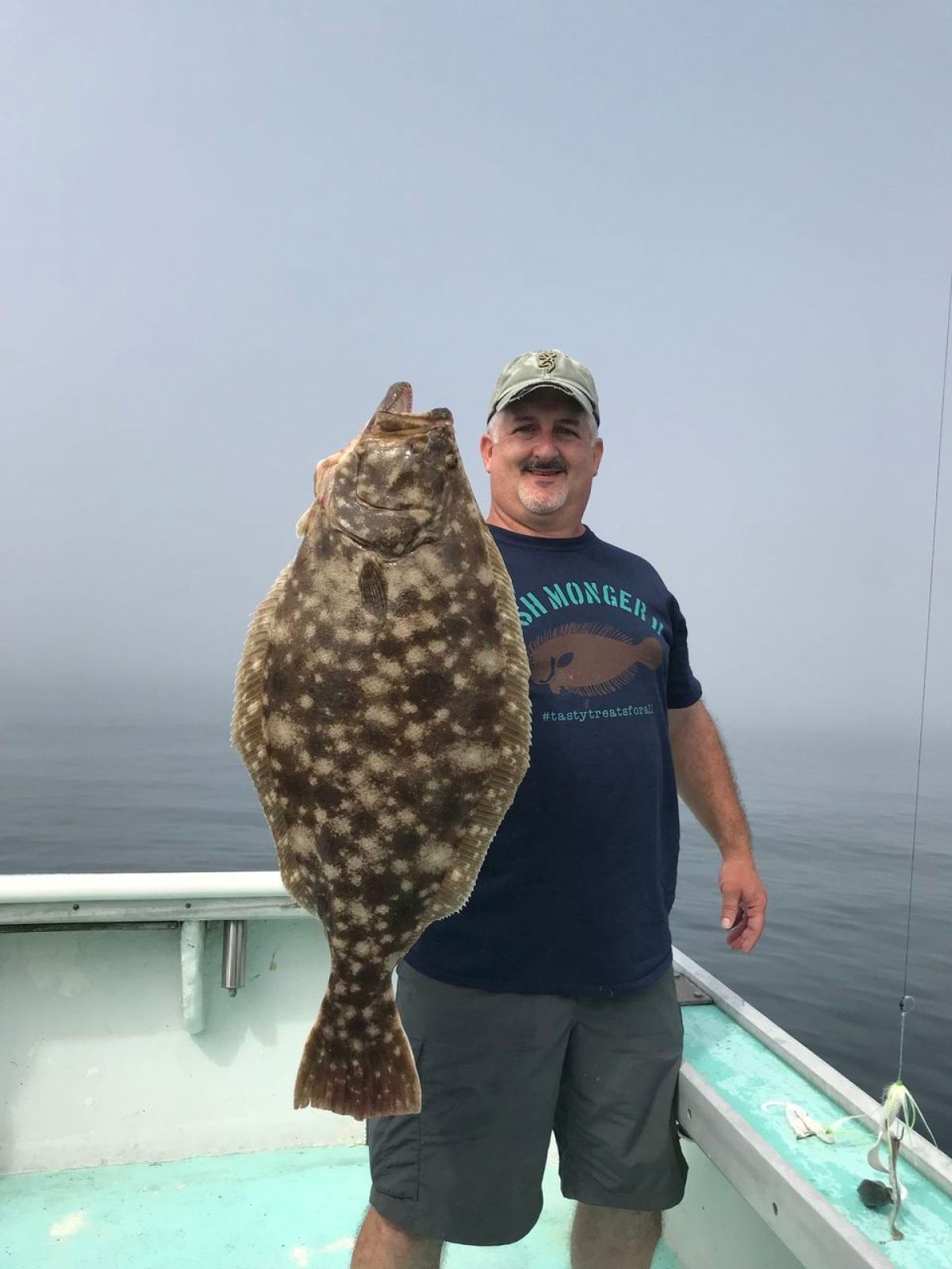 a man that is standing in the water