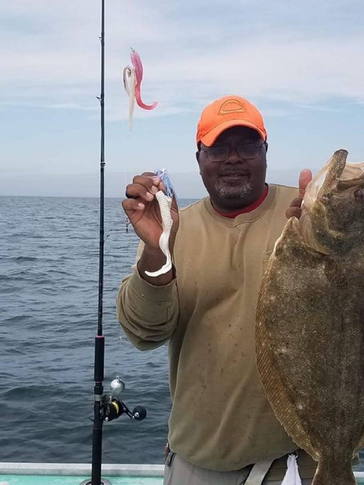 a man holding a fish in the water