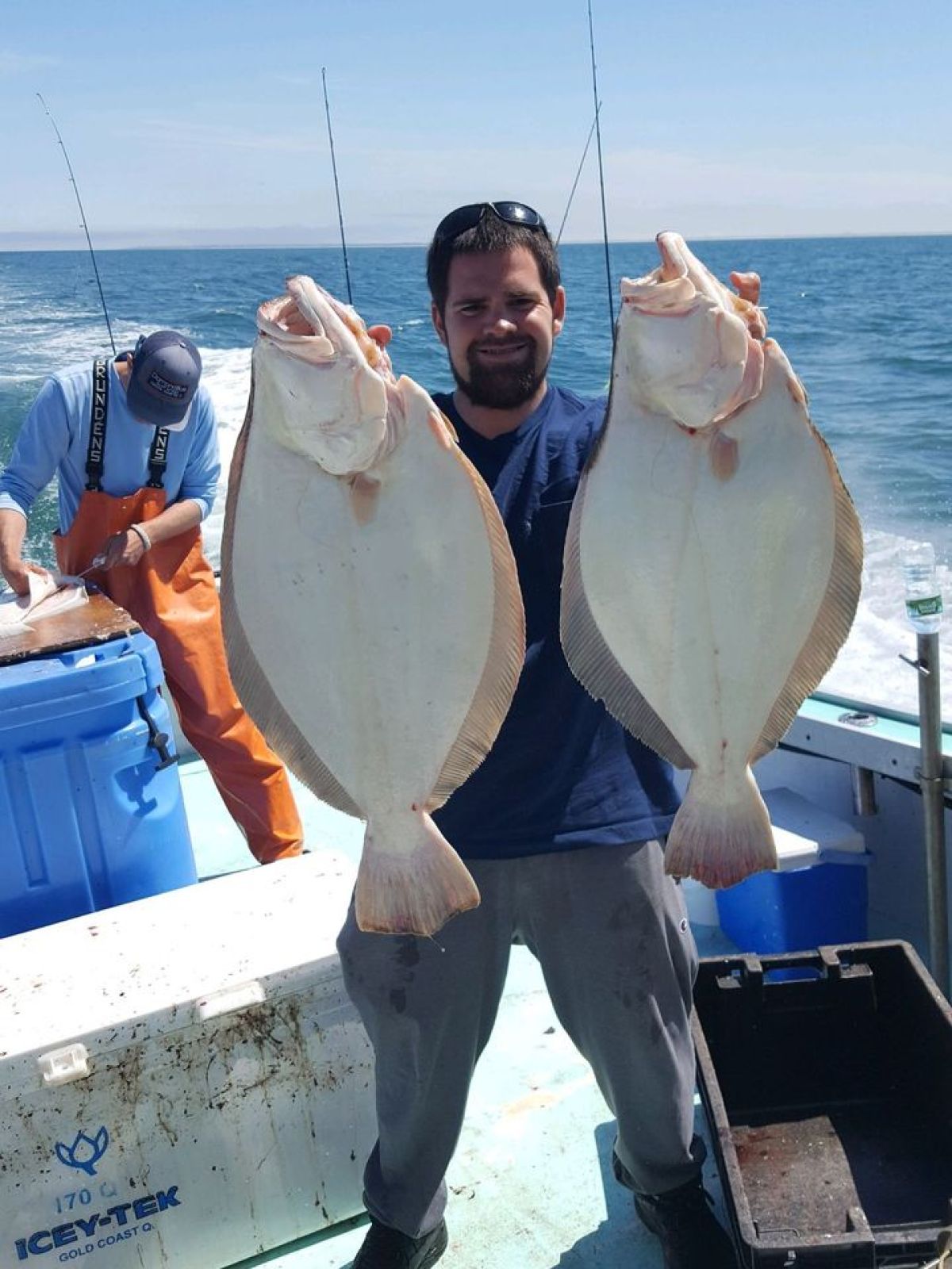 a person holding a fish in the water