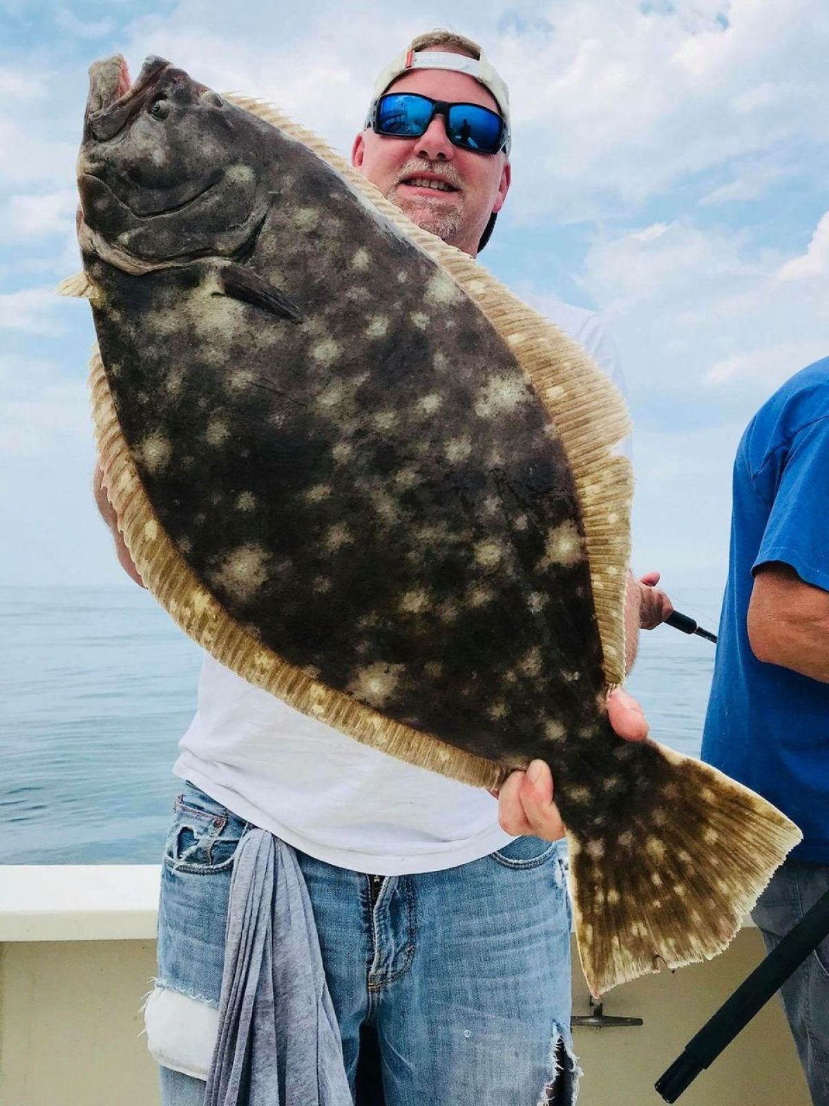 a person standing next to a body of water