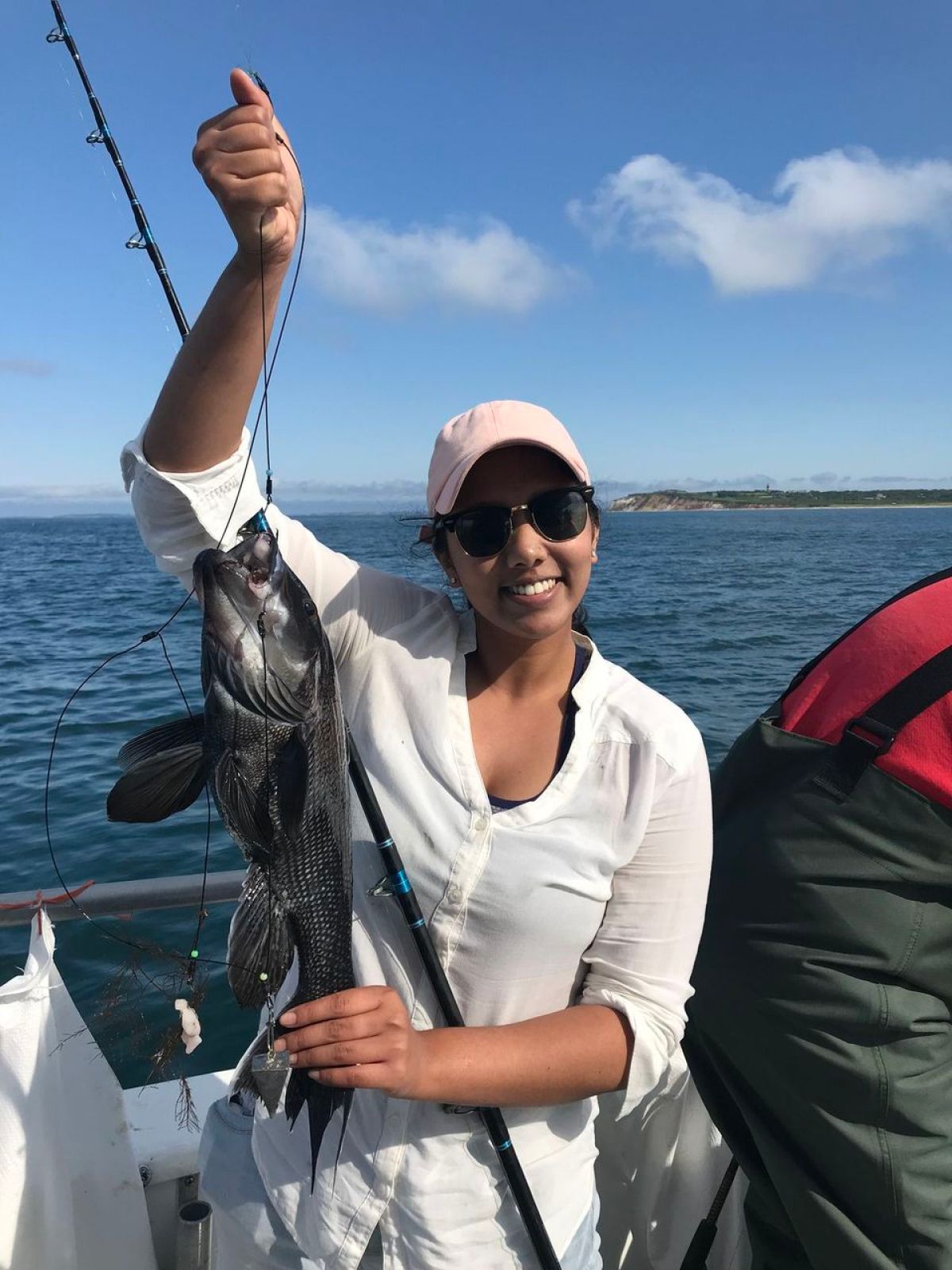 a person holding a fish in the water