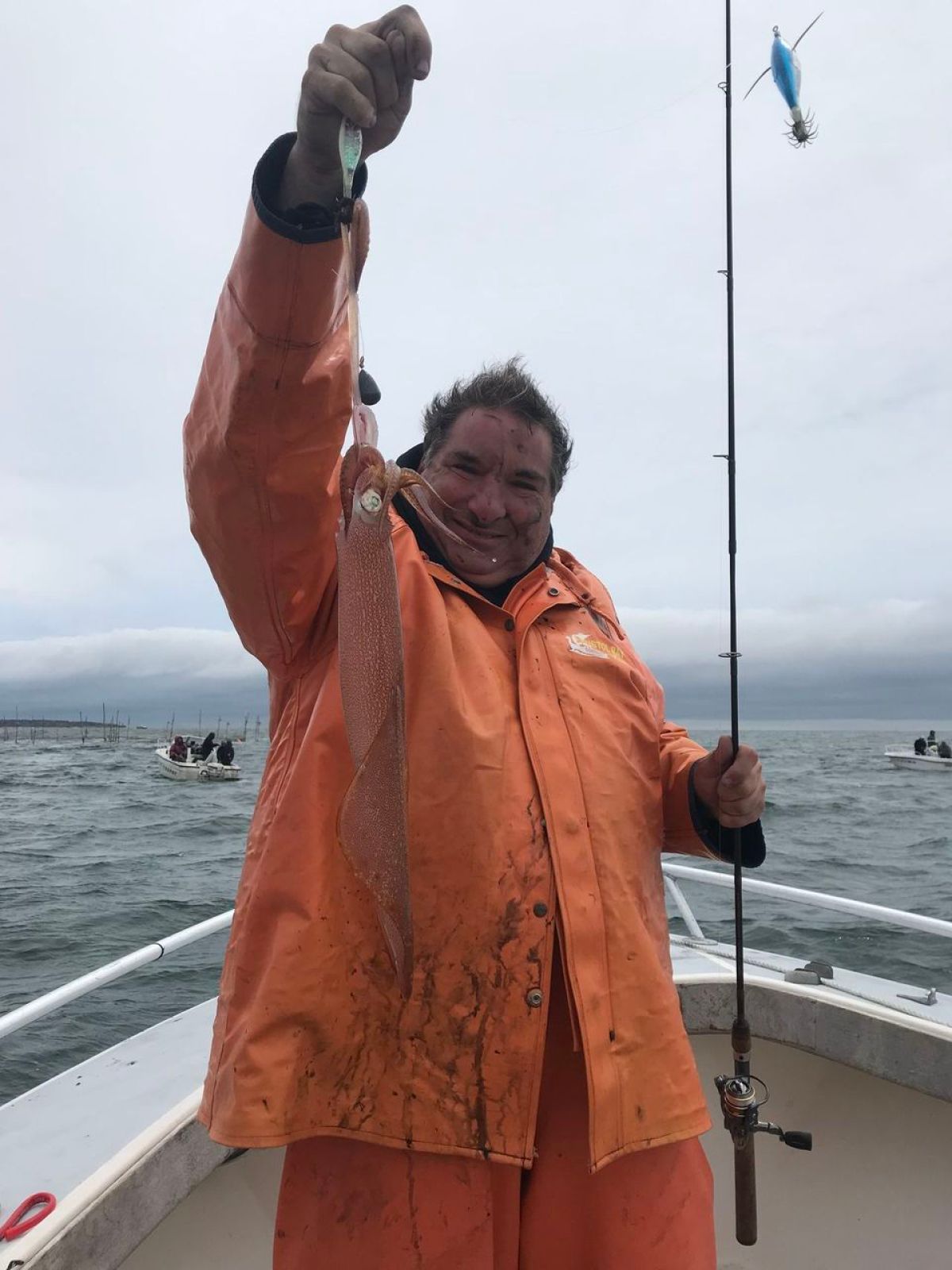 a woman standing next to a body of water