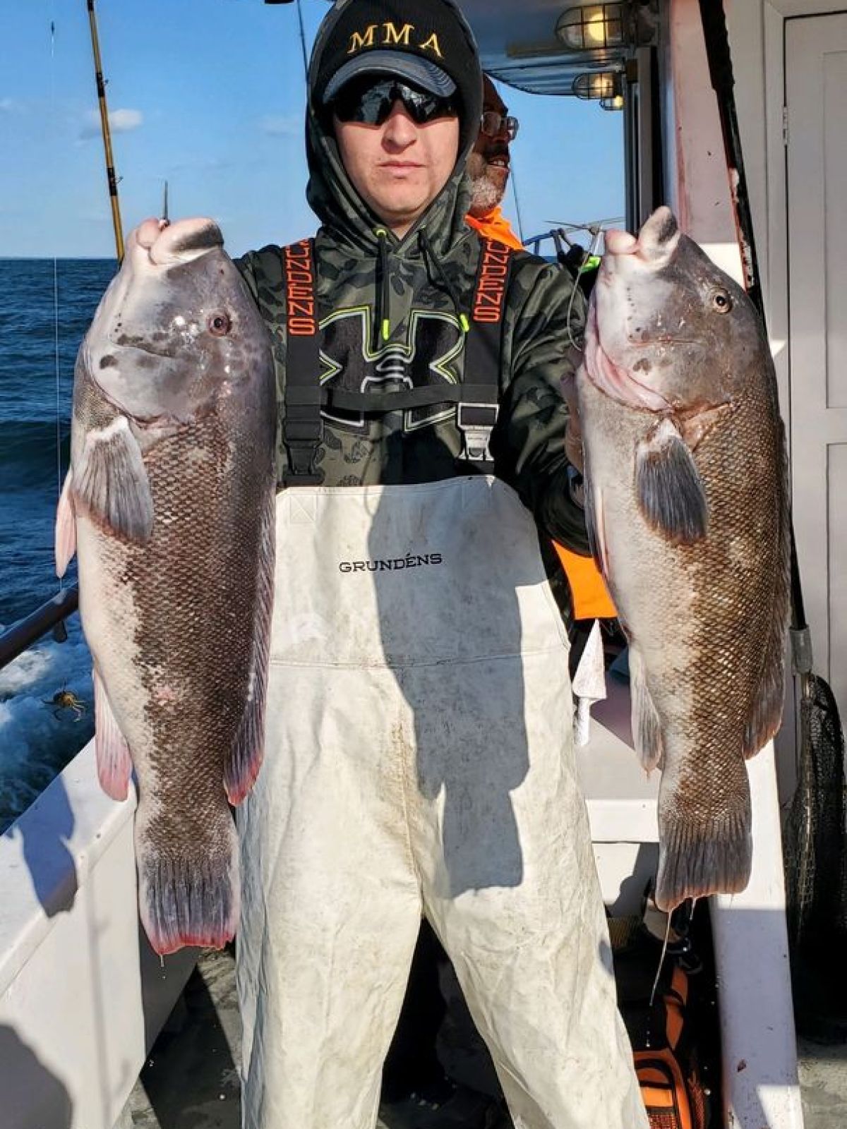 a man holding a fish