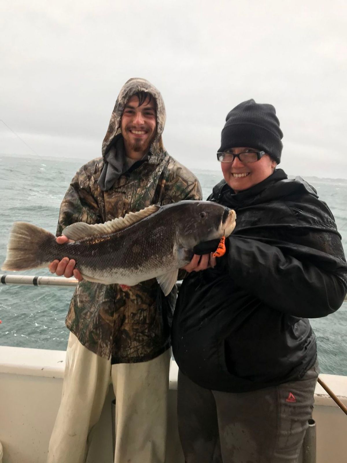 a man holding a fish