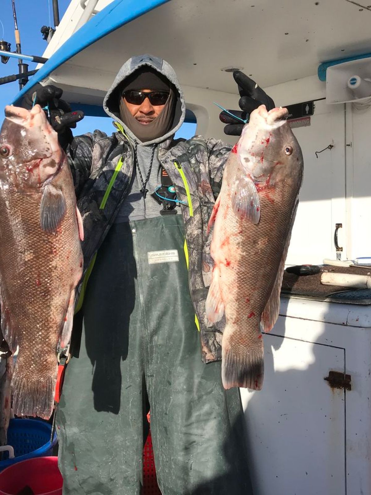 a man holding a fish