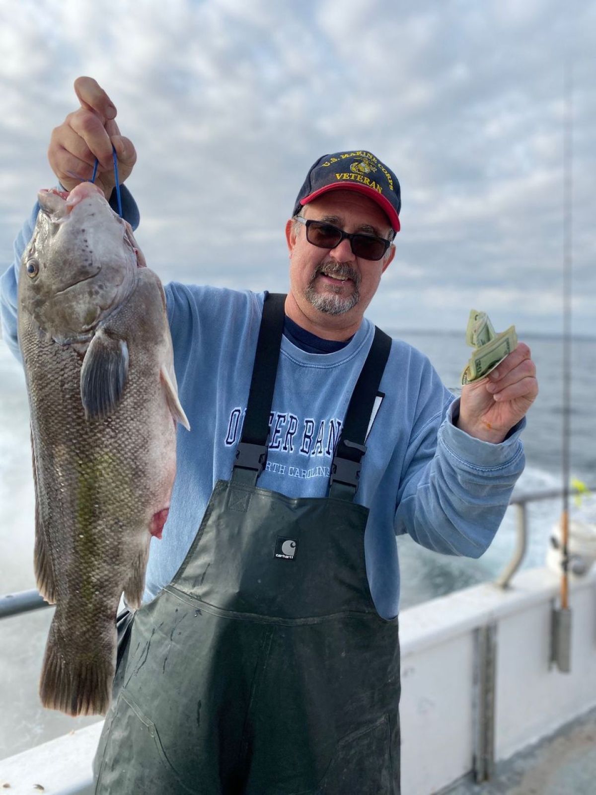 a man holding a fish